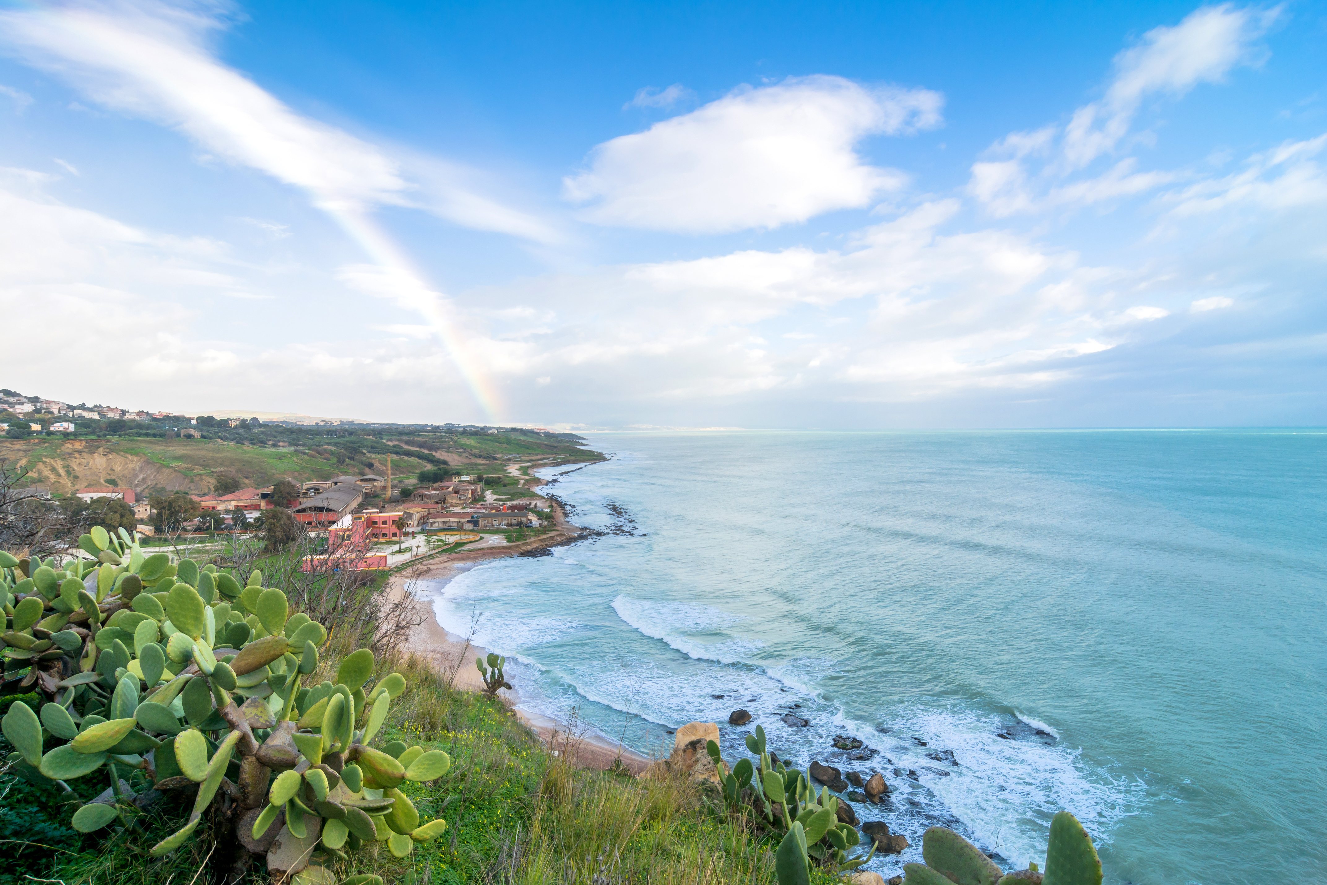 SCIACCA, ITALY - FEBRUARY 22, 2014: panoramic view of coastline with dramatic sky in Sciacca, Italy. Sciacca is known as the city of thermal baths since Greek domination in the 3rd and 4th centuries BC (licensed stock photo from Adobe Stock)